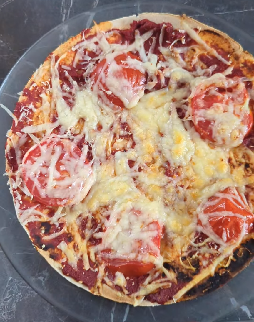 Homemade gluten-free wrap pizza with tomato and cheese